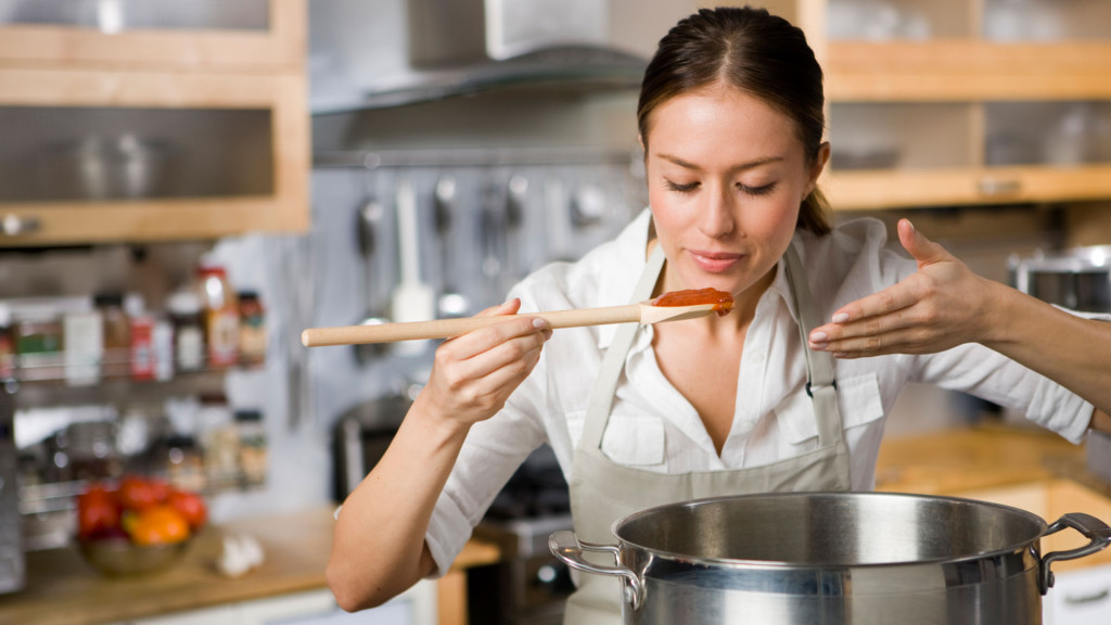 Woman-cooking-pasta-sauce